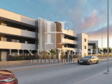 Modern middle floor apartment with large terrace, community pool, spa area and views of the lagoon, 