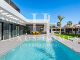Modern villa with private pool, large garden, roof top terrace, located in a golf resort urbanisatio