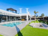 Modern villa with private pool, large garden, roof top terrace, located in a golf resort urbanisatio