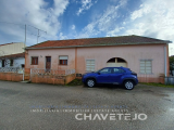 House and warehouse with patio in village.