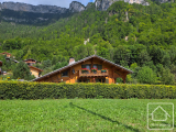 A pretty, modern chalet in a sunny location with beautiful gardens.
