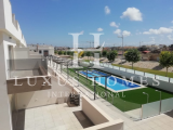 Brilliant top floor duplex with a large rooftop terrace and community pool located near the beach