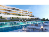 High End ground floor apartment with large garden, community pool and stunning sea view located clos