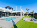 Modern villa with private pool, large garden, roof top terrace, located in a golf resort urbanisatio