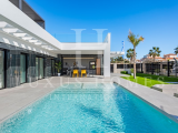 Modern villa with private pool, large garden, roof top terrace, located in a golf resort urbanisatio