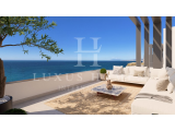 Elegant townhouse boasting sea-facing terraces, high-end finishes and private gardens, set within a 