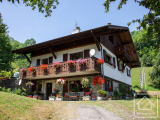 A property in a peaceful setting with generous living space across three apartments, ideal for famil