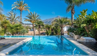 A six bedroom contemporary classic style villa is set on a large plot.